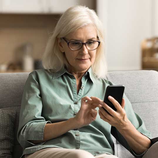 Woman looking at the phone Woman looking at the phone