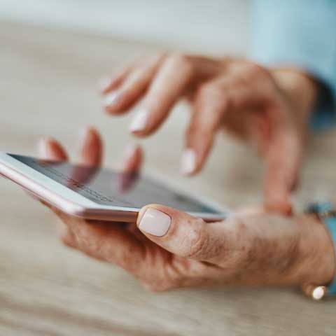 hand touching mobile phone hand touching mobile phone